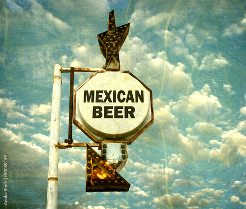 aged and worn vintage photo of mexican beer sign