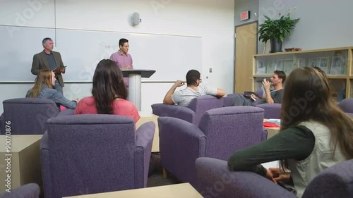Wallpaper Mural A student giving a presentation to the class and writing on the whiteboard
 Torontodigital.ca