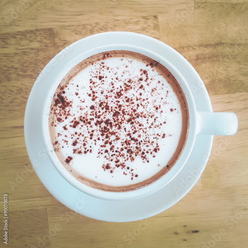 hot mocha coffee on wood table vintage tone