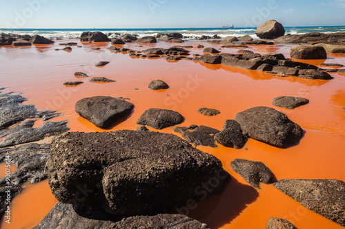 Industrial pollution damaging liquids pouring into ocean coastline blue waters