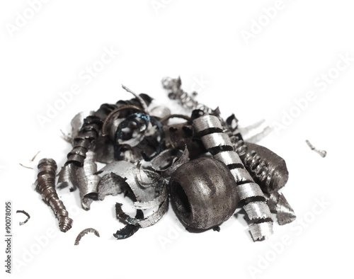 Fotografi pile scrap metal shavings isolated on white