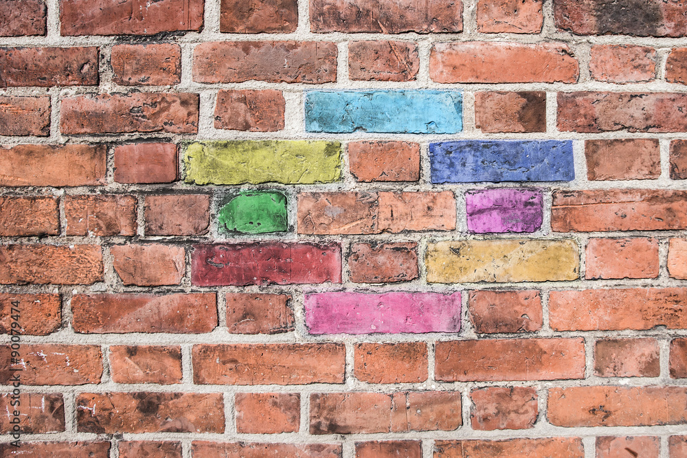 Fototapeta premium Grunge red brick wall texture with additional color bricks.
