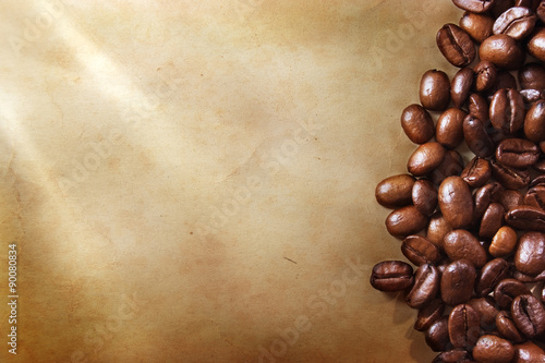 Coffee beans on grunge paper background © Alexstar