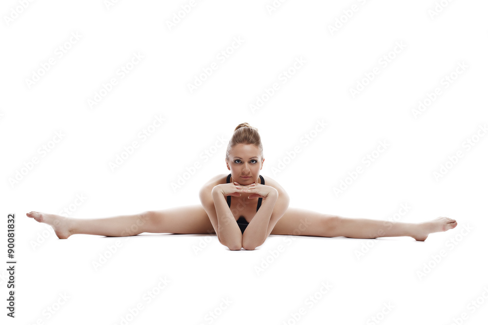 Nice woman posing while doing gymnastic split Nice woman posing while doing gymnastic split