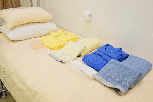 Clean hospitel dress on the bed in a ward photo