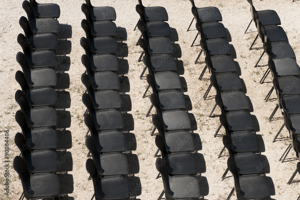 Fototapeta premium black chairs in a row