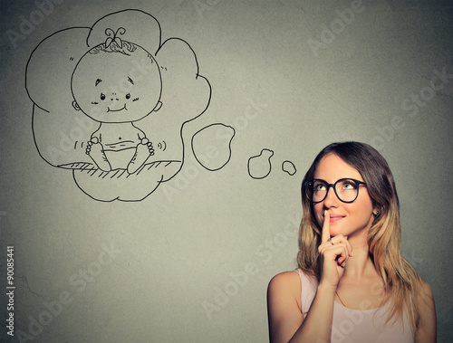 Canvas-taulu Portrait woman thinking dreaming of a child