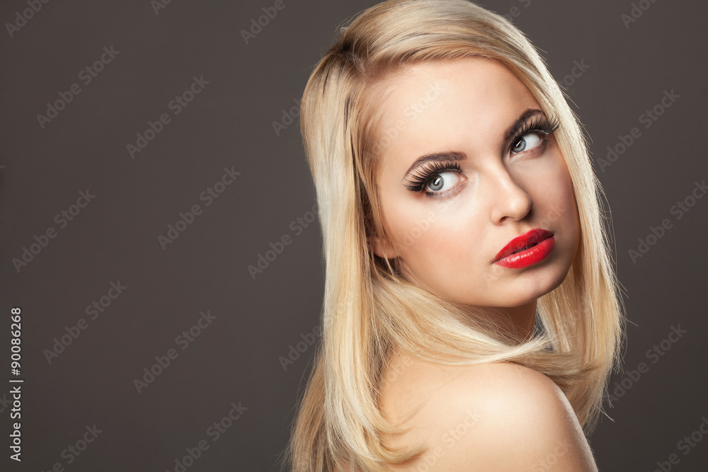 Fashion Stylish Beauty portrait of smiling beautiful blonde girl with professional make-up, false eyelashes and red lips in photostudio Fashion Stylish Beauty portrait of smiling beautiful blonde girl with professional make-up, false eyelashes and red lips in photostudio
