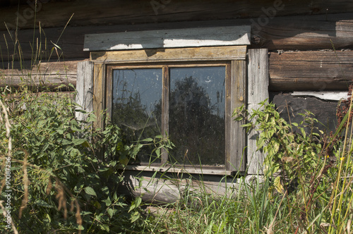 A window is old rustic home.