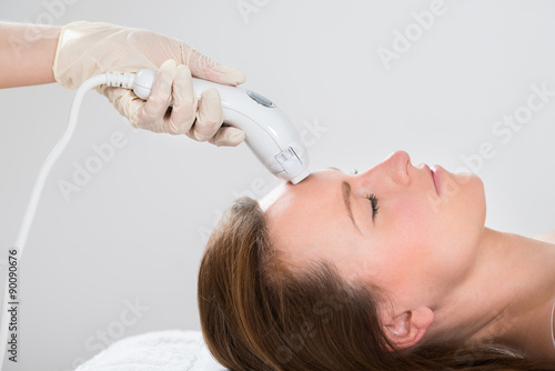 Woman Receiving Laser Hair Removal Treatment
