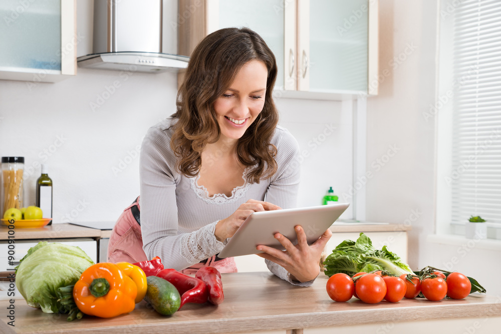 Woman With Digital Tablet And Vegetables
