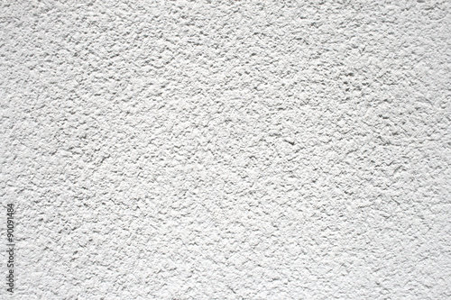 White coarse rough plaster material found on a house wall, texture material