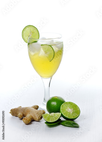 Lemonade and ginger isolated on wooden background.