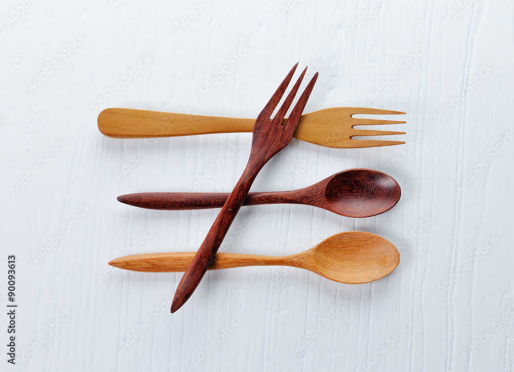 Wooden spoon and fork and wood board background Wooden spoon and fork and wood board background