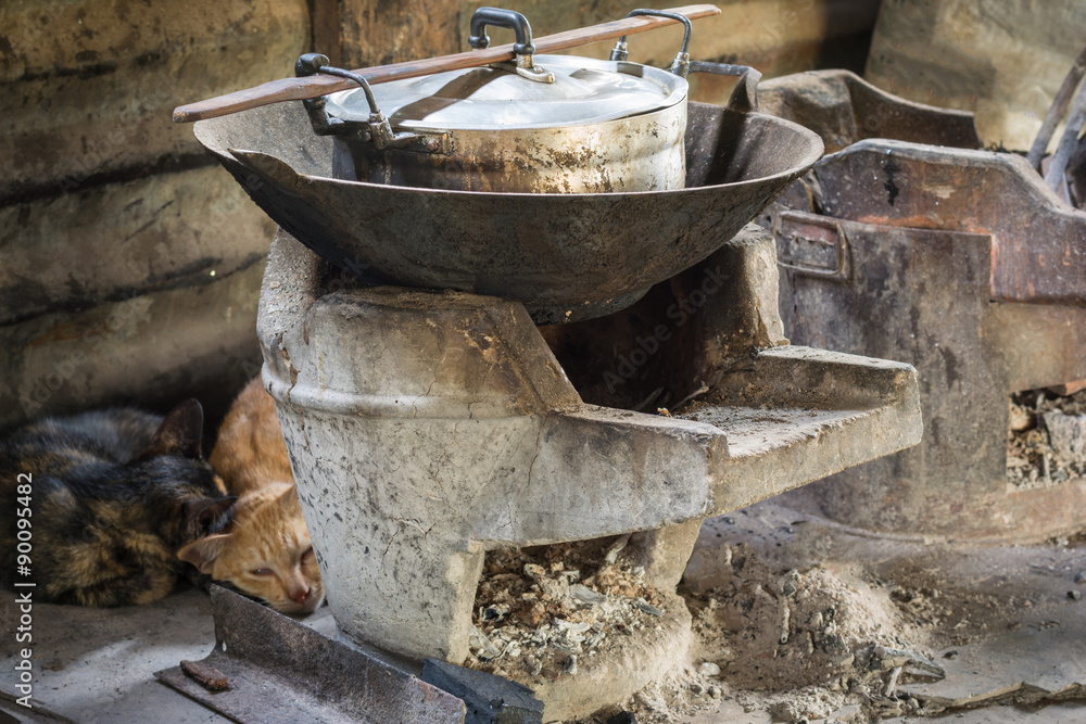 Wood stoves or Charcoal grills and pots in the kitchen of people Wood stoves or Charcoal grills and pots in the kitchen of people