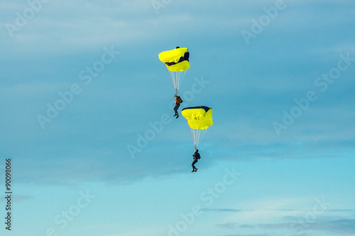 Two parachutist on bright parachutes