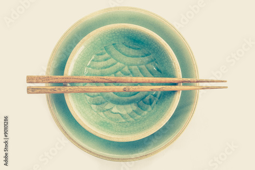Green celadon ceramic dish and wood chopstick ..