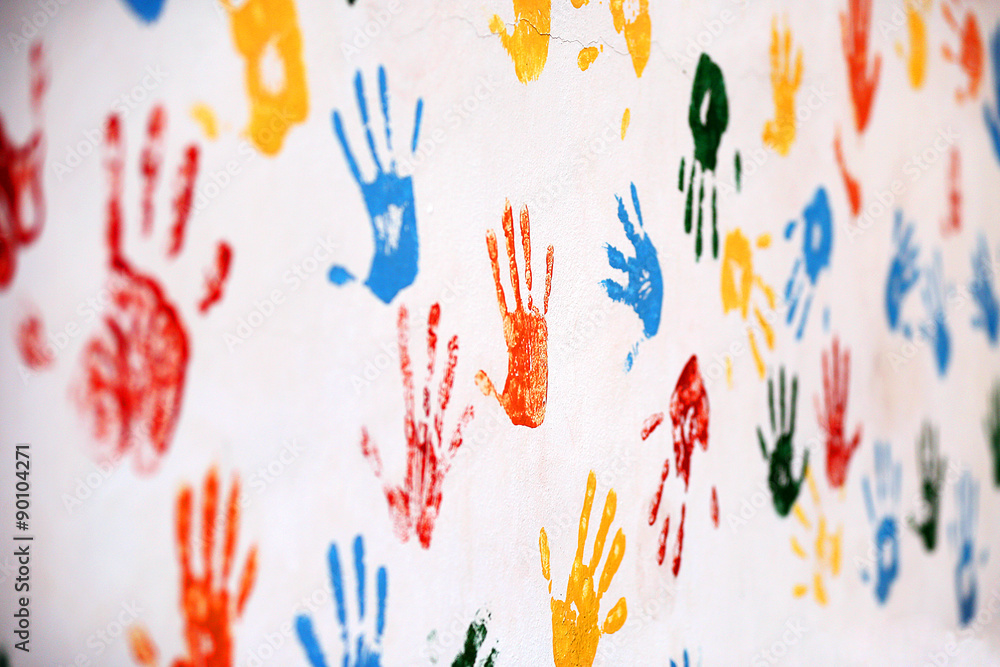 Wall with colored prints of human hand