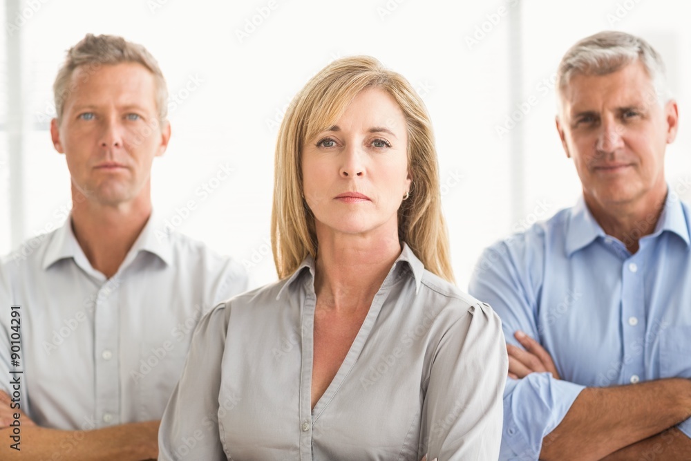 Serious casual business people with arms crossed Serious casual business people with arms crossed