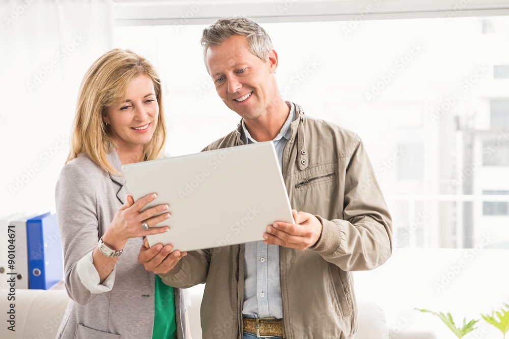 Casual business colleagues working with laptop Casual business colleagues working with laptop