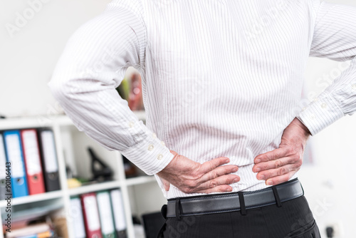 Businessman suffering from back pain