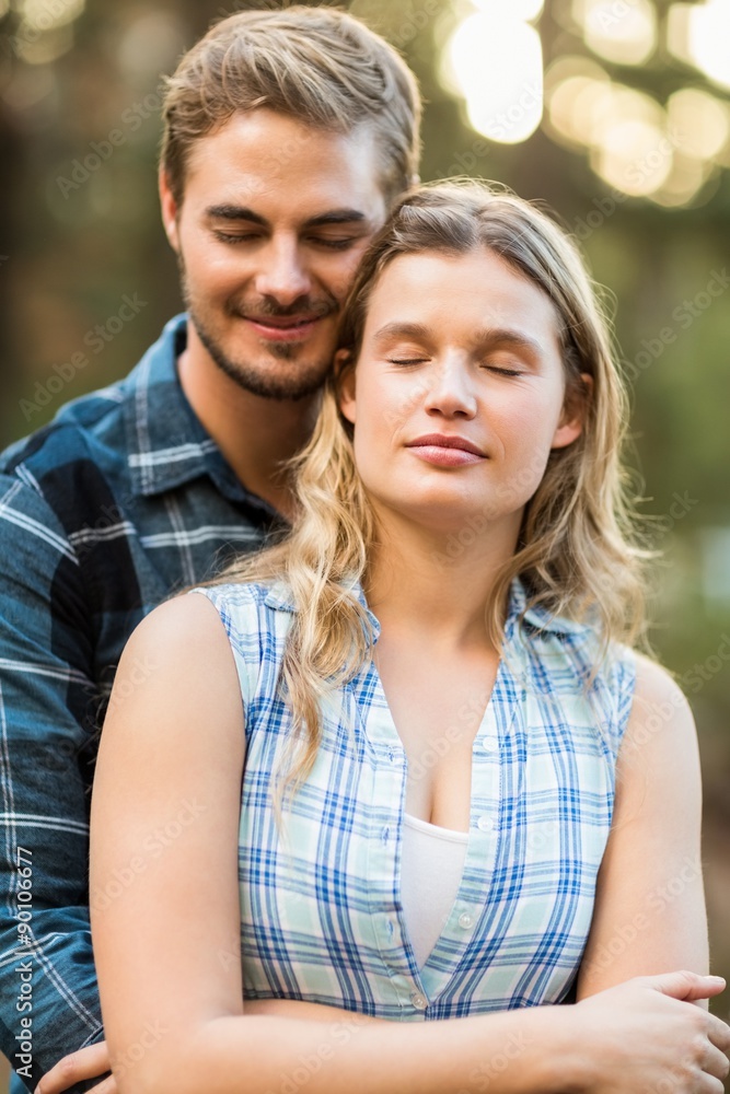 Fototapeta premium Happy smiling couple embracing with eyes closed