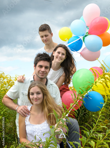 Happiness  Young couples with colorful balloons   
