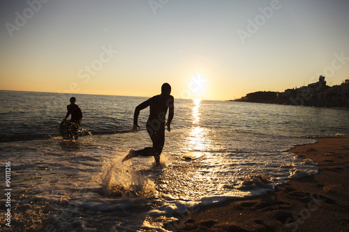 Surfing in San Pol de Mar in the coast of Catalonia, Spain photo