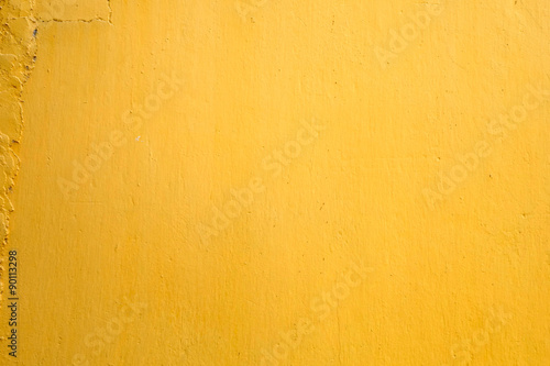 Yellow paint concrete wall texture background