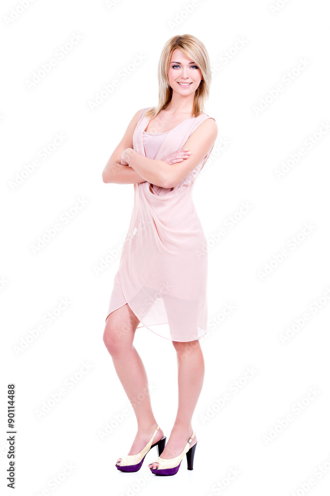 Portrait of young smiling woman in pink dress. Portrait of young smiling woman in pink dress.