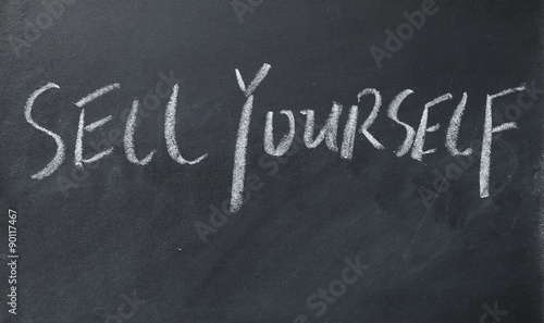 sell yourself text write on blackboard photo