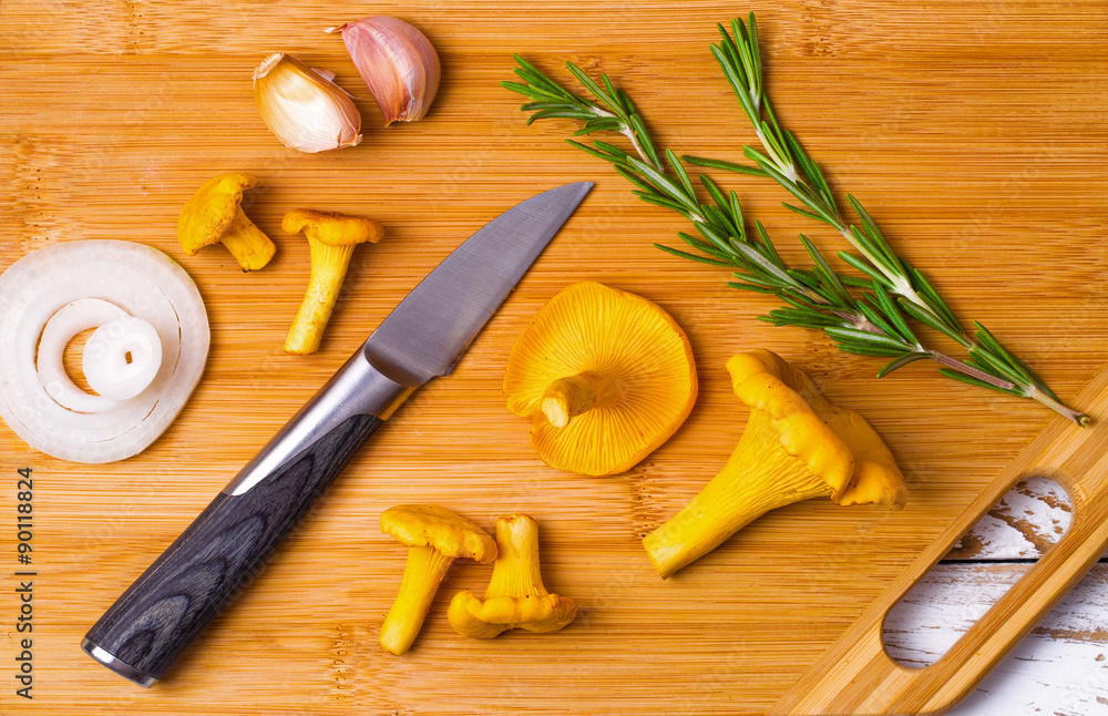 Chanterelles and knife on a table Chanterelles and knife on a table