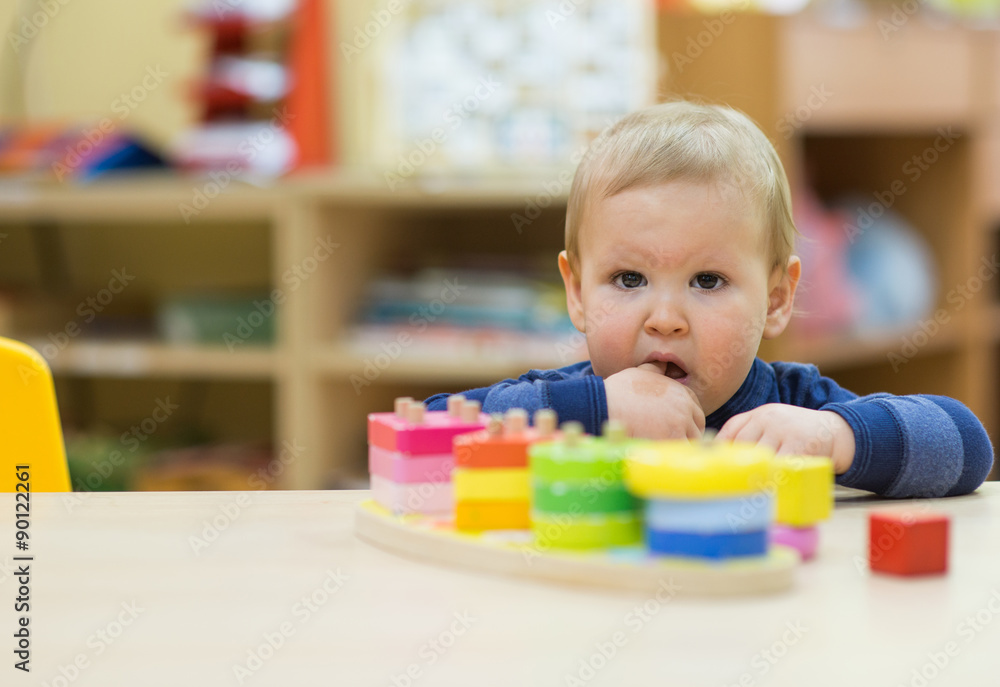 kid boy playing at home or play-school kid boy playing at home or play-school