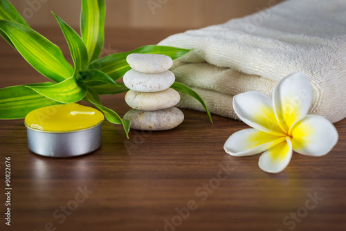 Spa still life with aromatic candles flower and towel