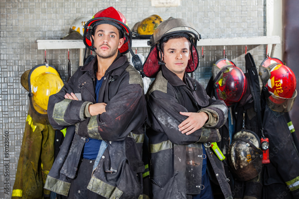 Fototapeta premium Confident Firemen Standing Arms Crossed