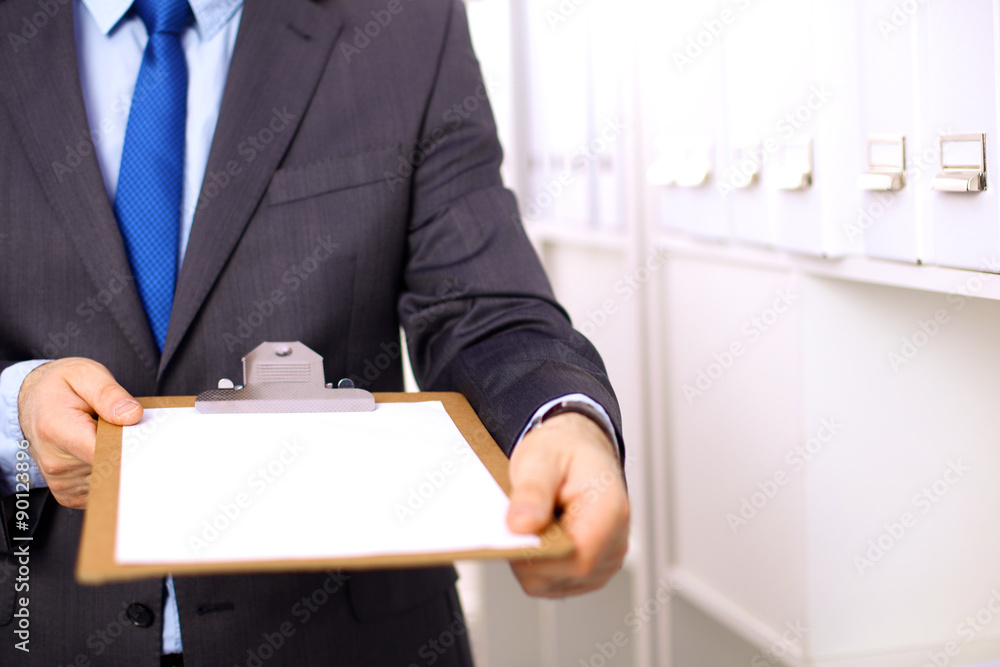 Many papers orderly arranged in a file shelves. And some are Many papers orderly arranged in a file shelves. And some are