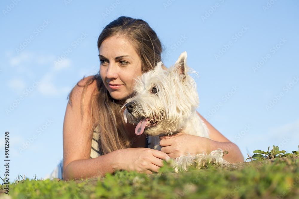 portrait of beautiful girl keeping pretty white West Highland portrait of beautiful girl keeping pretty white West Highland