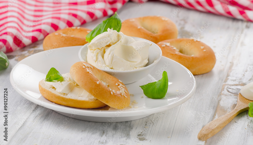 Fototapeta premium Bagels with cream cheese for a breakfast.
