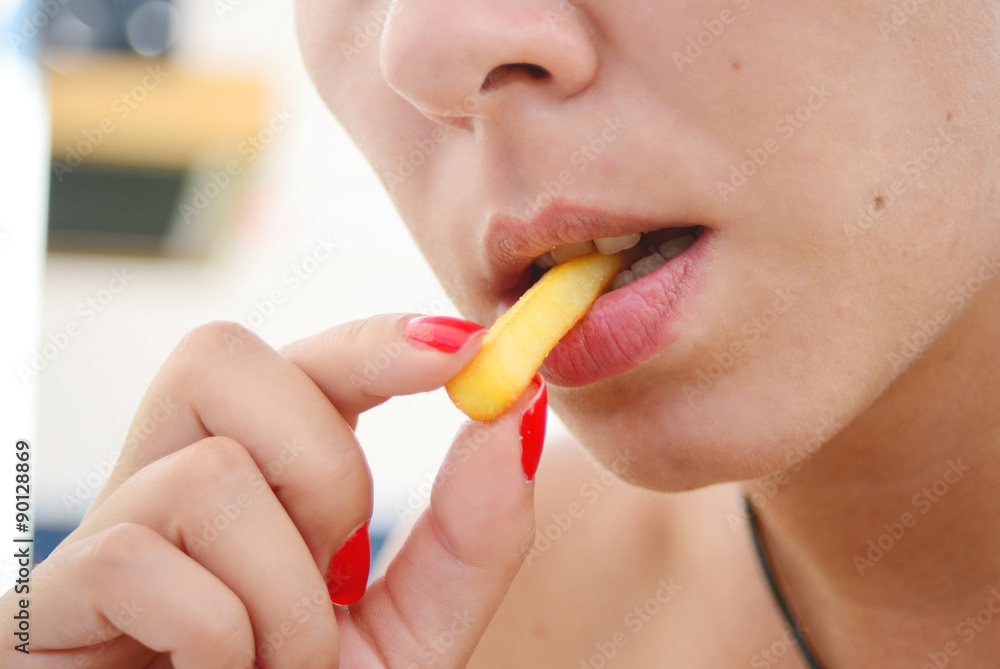 woman eating fries woman eating fries