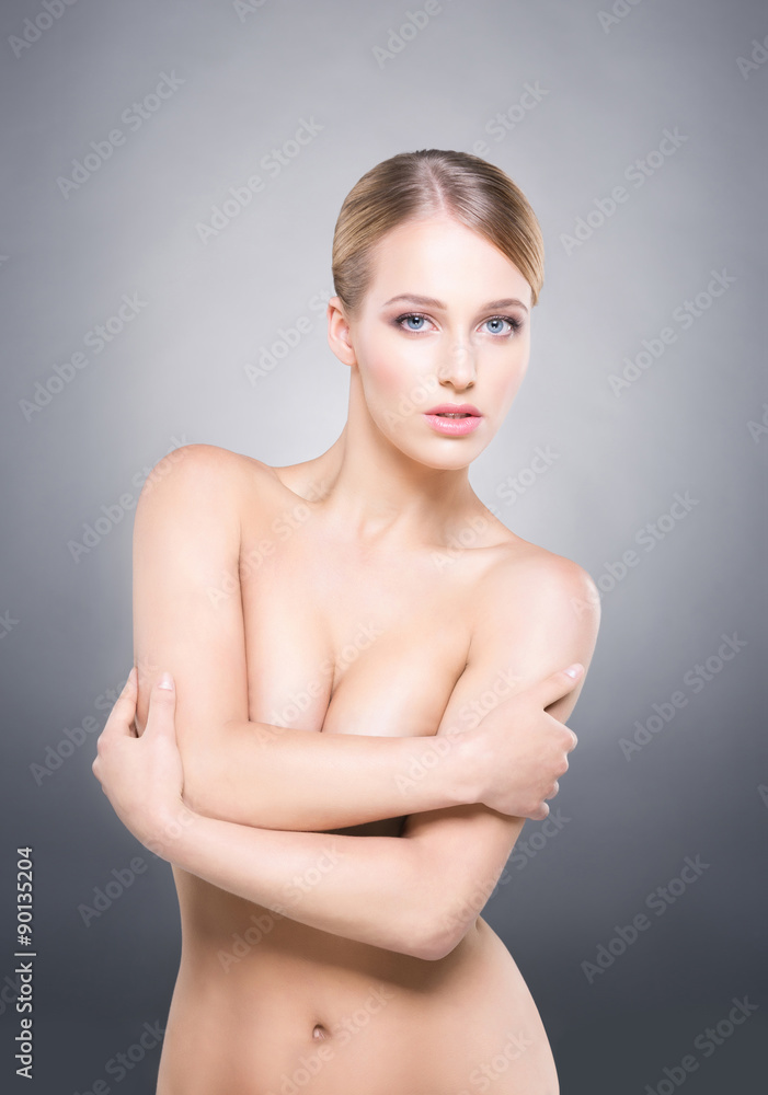 Gorgeous and seductive woman over grey background. Gorgeous and seductive woman over grey background.