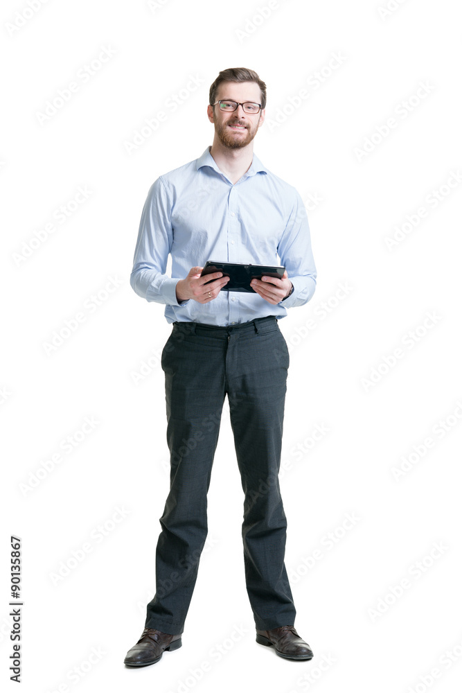 Confident and successful businessman with a beard holding a tablet. Confident and successful businessman with a beard holding a tablet.