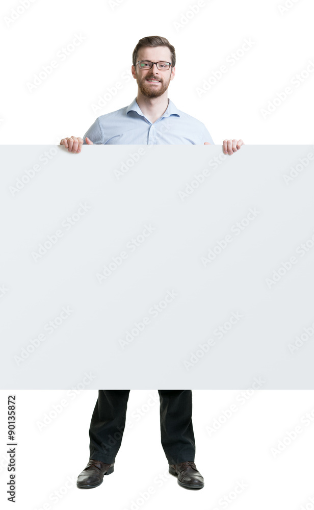 Happy man in formalwear with a beard holding a banner on isolated background. Happy man in formalwear with a beard holding a banner on isolated background.