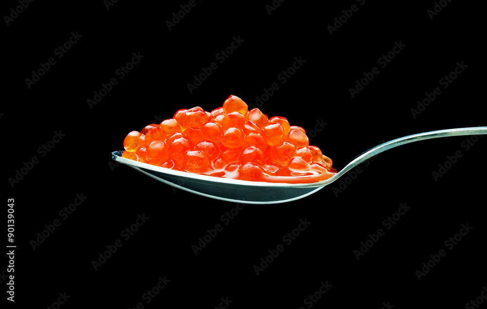 spoon of red caviar on black background spoon of red caviar on black background