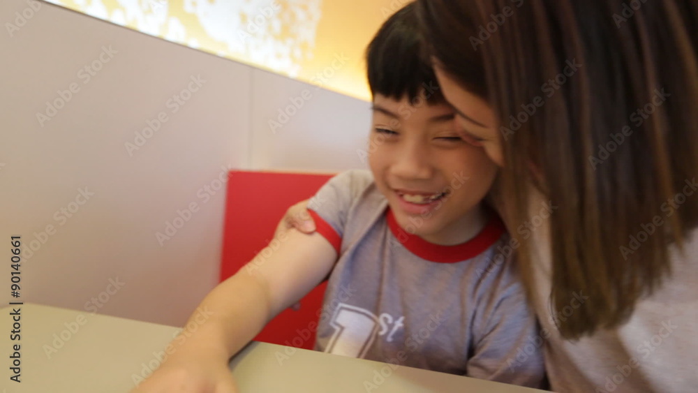 Happy asian mother and son are playing together Happy asian mother and son are playing together