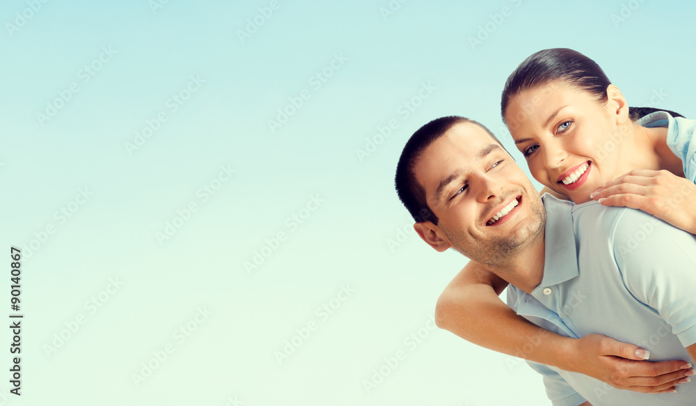 Cheerful young couple, over blue Cheerful young couple, over blue
