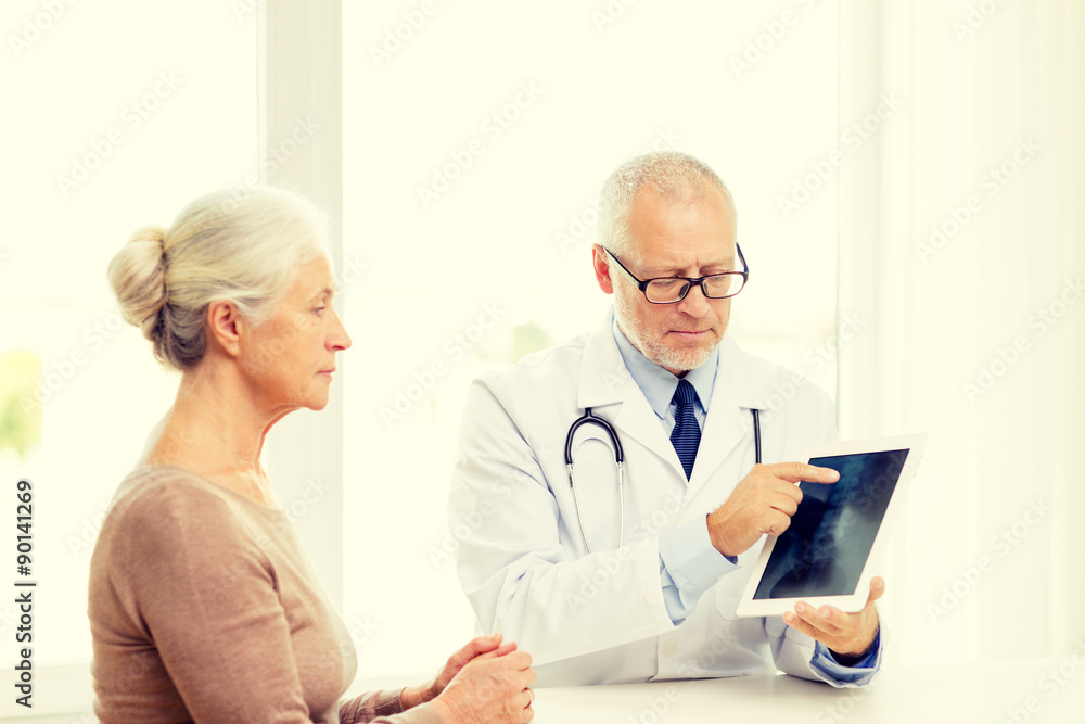 Fototapeta premium senior woman and doctor with tablet pc
