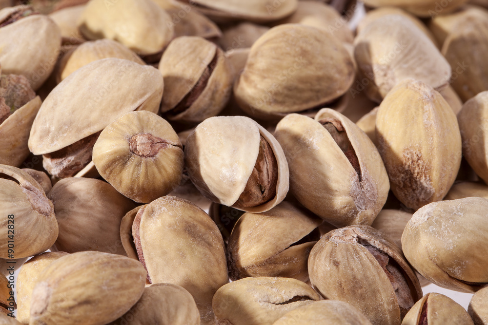 background of dried pistachios close up background of dried pistachios close up