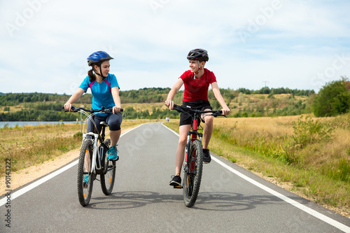 Healthy lifestyle - teenage girl and boy cycling  © Jacek Chabraszewski
