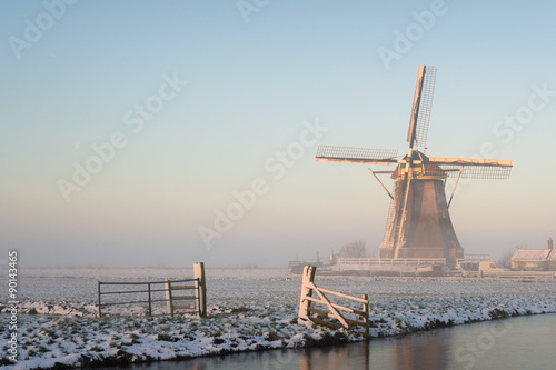Winter landscape in the Netherlands with a windmill