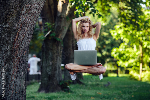 girl levitates with laptop